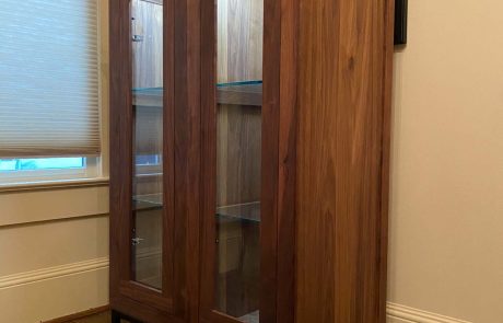 Large wooden two door display cabinet