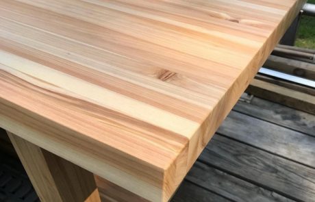 Detail of a wooden dining table in progress