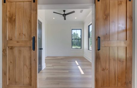 Handmade barn doors opening into a bedroom