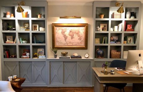 Custom gray wall to wall bookshelf in a library